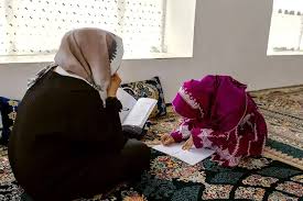 Afghan women participating in a community learning session