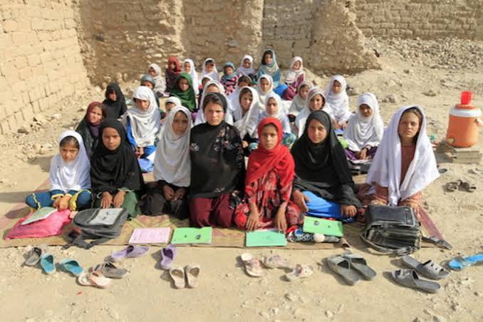 Afghan girls participating in an outdoor learning activity in Afghanistan