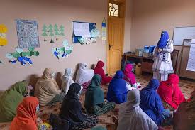 Afghan women and girls participating in a classroom learning session