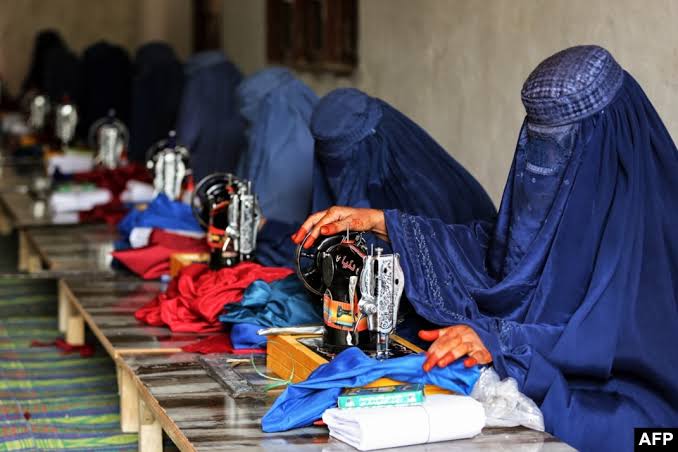 Afghan women participating in vocational sewing training