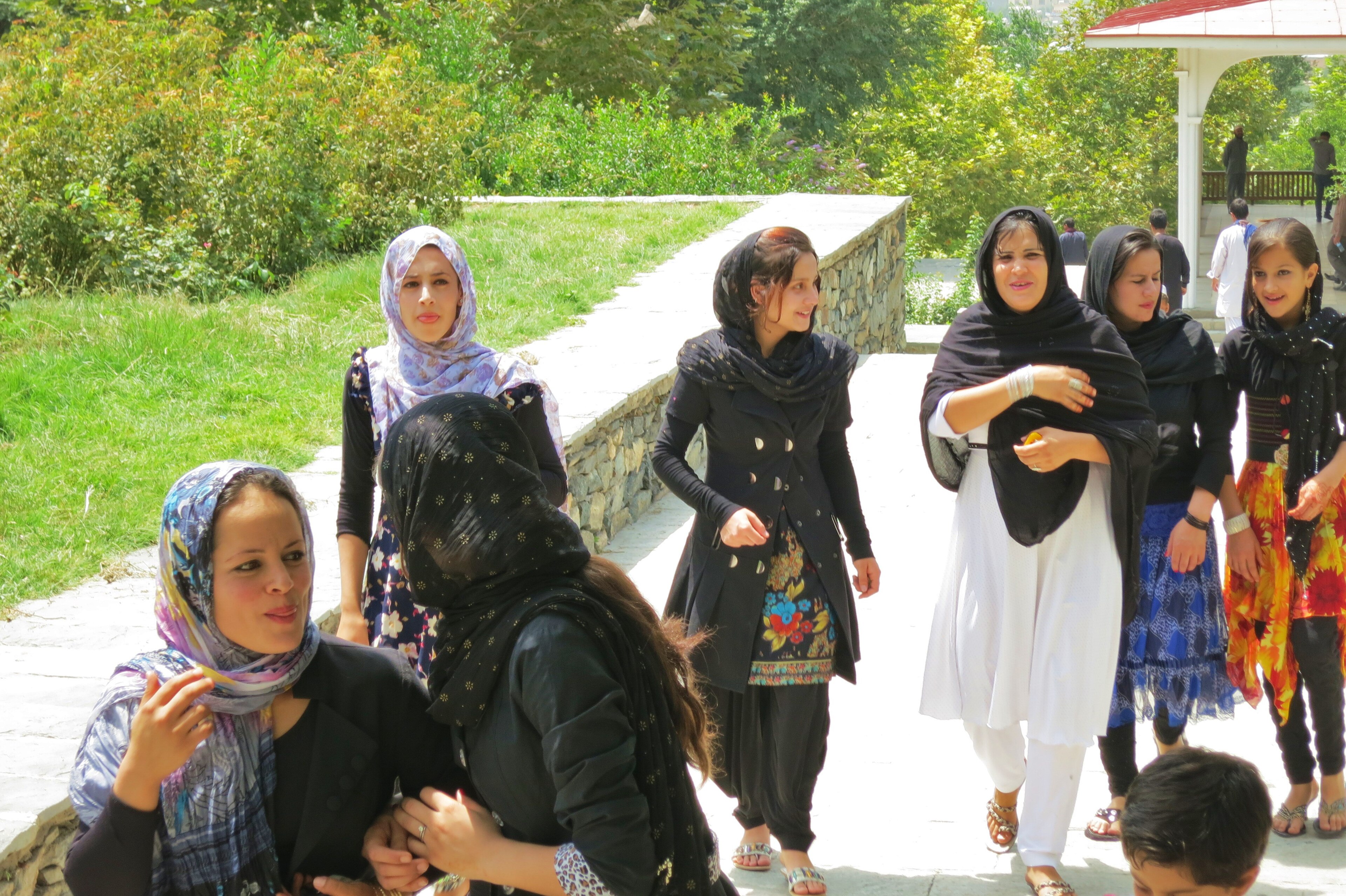 Afghan women and girls gathered in a community setting