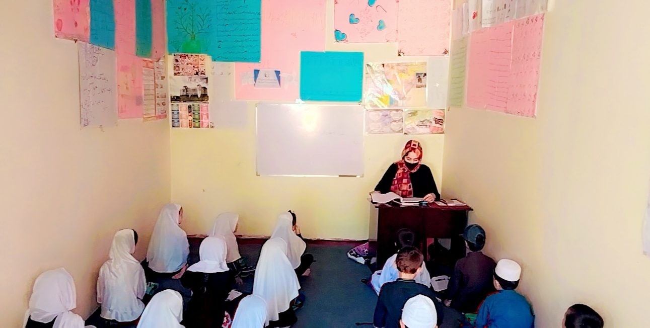 Afghan women and girls participating in classroom learning