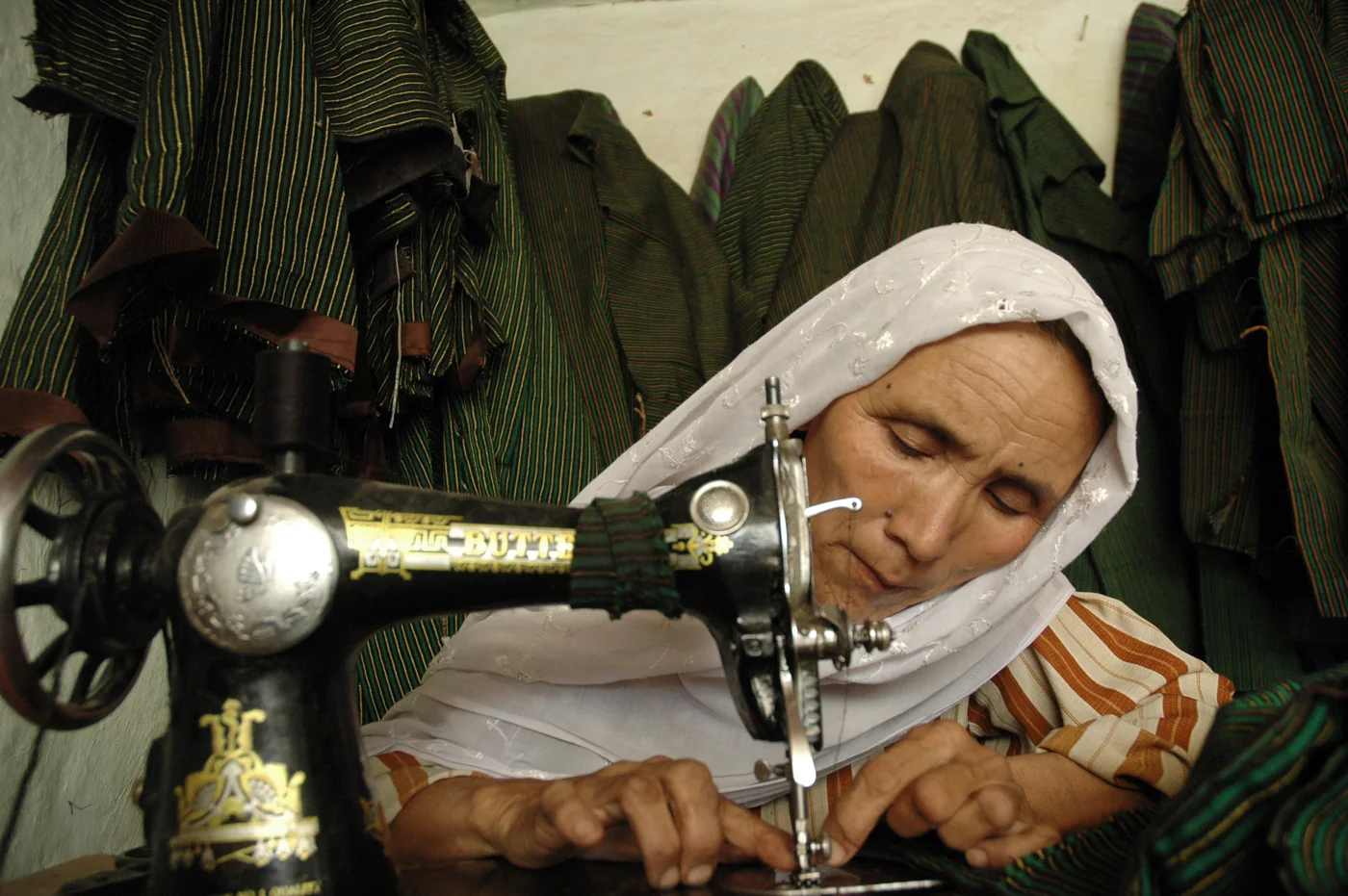 Afghan woman working at a sewing machine