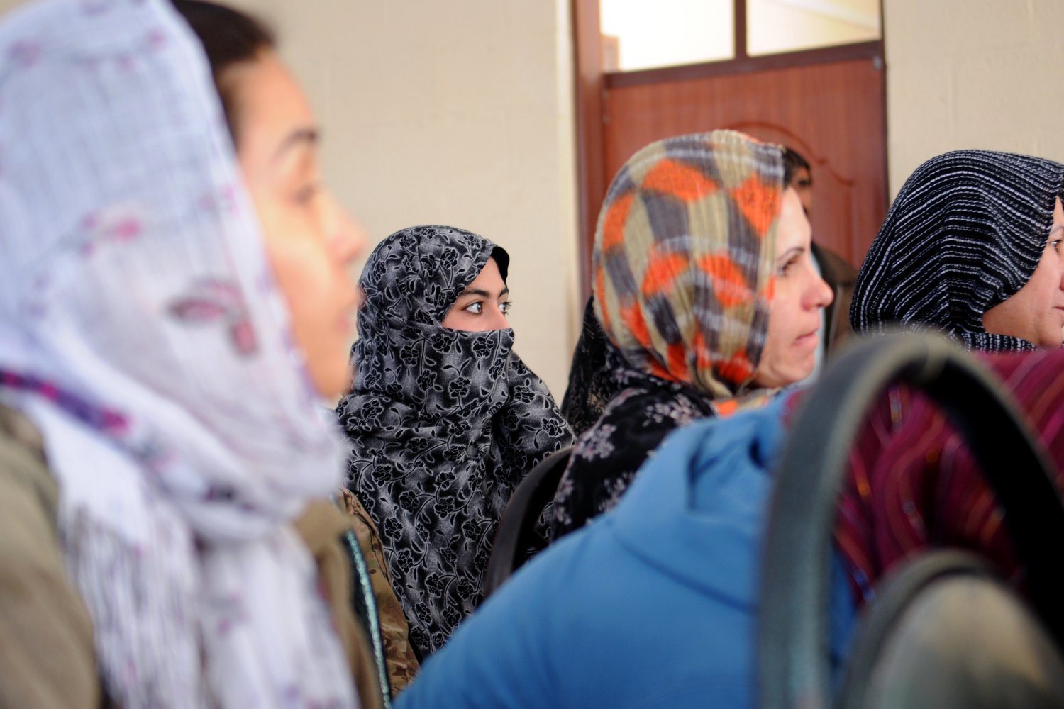 Afghan community members discussing safeguarding and respectful participation